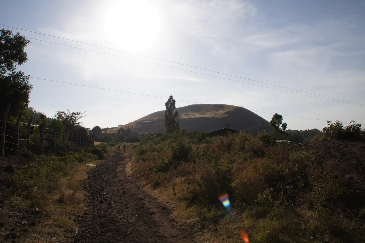 A dirt road stretching through the Ethiopian landscape